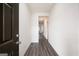 Inviting entryway featuring sleek wood-look floors, modern decor, and plenty of natural light at 7301 Cranleigh St, Covington, GA 30014