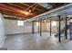 Unfinished basement with concrete floor, exposed ceiling and support beams at 4178 Castle Pines Ct, Tucker, GA 30084