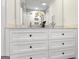 Bathroom with double sink vanity, marble counters and built in drawers at 4178 Castle Pines Ct, Tucker, GA 30084