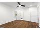Bright bedroom with ensuite bathroom, hardwood floors and ceiling fan at 4178 Castle Pines Ct, Tucker, GA 30084