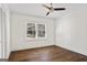 A spacious bedroom with hardwood floors and a ceiling fan with lighting at 4178 Castle Pines Ct, Tucker, GA 30084