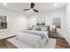 Cozy bedroom with hardwood floors, neutral paint, natural light, and a comfortable king-sized bed at 4178 Castle Pines Ct, Tucker, GA 30084