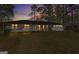 Exterior of a white brick home with a large front lawn and a two car garage at sunset at 4178 Castle Pines Ct, Tucker, GA 30084