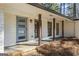 Inviting front entrance featuring a stylish door, brick accents, and a covered porch at 4178 Castle Pines Ct, Tucker, GA 30084