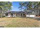Beautiful ranch-style home with brick exterior and mature trees in a well-maintained front yard at 4178 Castle Pines Ct, Tucker, GA 30084