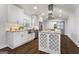 Modern kitchen with white cabinets, granite countertops, stainless steel appliances, and hardwood floors at 4178 Castle Pines Ct, Tucker, GA 30084