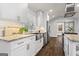 Updated kitchen with stainless appliances, granite counters, white cabinets and hardwood floors at 4178 Castle Pines Ct, Tucker, GA 30084