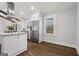 Kitchen with stainless appliances, granite counters, white cabinets and hardwood floors at 4178 Castle Pines Ct, Tucker, GA 30084