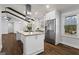 Modern kitchen with stainless appliances, bright lighting, and an island at 4178 Castle Pines Ct, Tucker, GA 30084