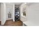 Convenient laundry room with stacked washer/dryer, window and folding bench at 4178 Castle Pines Ct, Tucker, GA 30084