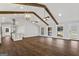 Bright, open living room featuring hardwood floors, wood beams, and lots of natural light at 4178 Castle Pines Ct, Tucker, GA 30084