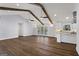 Living room and kitchen with hardwood floors, white cabinets and views of the outside deck at 4178 Castle Pines Ct, Tucker, GA 30084