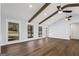 Living room featuring hardwood floors, bright windows, and a painted white door at 4178 Castle Pines Ct, Tucker, GA 30084