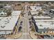 Aerial view capturing a well-maintained town street with an array of buildings and ample parking on a bright day at 4178 Castle Pines Ct, Tucker, GA 30084