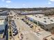 Overhead street shot shows neat commercial area with parked cars, pedestrian crossings, and local shops on a sunny day at 4178 Castle Pines Ct, Tucker, GA 30084