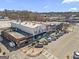 Aerial view featuring a line of commercial buildings with street parking, showcasing vibrant local businesses and community spaces at 4178 Castle Pines Ct, Tucker, GA 30084