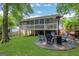 Inviting backyard with a patio, outdoor seating, and a well-manicured lawn at 792 Mimosa Se Dr, Marietta, GA 30060