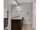Bathroom featuring granite vanity top, dual sinks, and a large mirror at 792 Mimosa Se Dr, Marietta, GA 30060