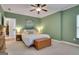 Bedroom showcasing a queen bed, ceiling fan, dresser and wood chest at foot of bed at 792 Mimosa Se Dr, Marietta, GA 30060