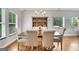 Bright dining room featuring large windows, a statement hutch, and elegant seating at 792 Mimosa Se Dr, Marietta, GA 30060