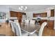 An elegant dining room featuring a chandelier, wooden cabinets, and seating for six at 792 Mimosa Se Dr, Marietta, GA 30060