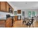 Updated kitchen featuring granite countertops, stainless steel appliances, and an open dining space at 792 Mimosa Se Dr, Marietta, GA 30060