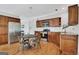 Cozy kitchen with stainless steel appliances, wooden cabinets and a dining table at 792 Mimosa Se Dr, Marietta, GA 30060