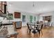 Well-lit kitchen with granite countertops, stainless steel appliances, and adjacent dining area at 792 Mimosa Se Dr, Marietta, GA 30060