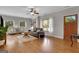 Open-concept living room with hardwood floors, a ceiling fan, and bright, airy feel at 792 Mimosa Se Dr, Marietta, GA 30060