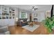 Comfortable living room featuring hardwood floors, built-in shelves, and stylish decor at 792 Mimosa Se Dr, Marietta, GA 30060