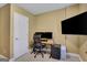 Home office featuring a modern desk with dual monitors and a sleek black filing cabinet at 792 Mimosa Se Dr, Marietta, GA 30060
