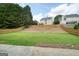 Large, level backyard with a wood fence, perfect for outdoor activities and entertaining at 412 Middlebrooke St, Canton, GA 30115