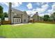 Lush backyard featuring a gazebo and concrete patio, ideal for relaxation and gatherings at 412 Middlebrooke St, Canton, GA 30115