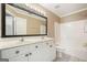 Bathroom featuring a double sink vanity with large mirrors and a shower and tub combination at 412 Middlebrooke St, Canton, GA 30115
