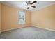 Carpeted bedroom with a ceiling fan, and ample natural light at 412 Middlebrooke St, Canton, GA 30115
