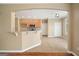 Kitchen with light wood cabinets, granite countertops, and an archway to the living room at 412 Middlebrooke St, Canton, GA 30115