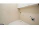 Laundry room featuring white cabinets, white floor tiles, and hookups for a washer and dryer at 412 Middlebrooke St, Canton, GA 30115