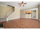 Spacious living room with wood floors, a fireplace, and an open layout into the kitchen area at 412 Middlebrooke St, Canton, GA 30115