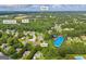 Aerial view of the home with a pool surrounded by lush trees and landscaping at 684 Doe Lane Ln, Loganville, GA 30052