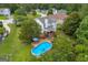 Overhead view of a home with a deck, swimming pool and well-maintained backyard at 684 Doe Lane Ln, Loganville, GA 30052