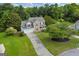 Aerial view of a beautiful two-story home with a well manicured front lawn and landscaping at 684 Doe Lane Ln, Loganville, GA 30052