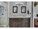 Modern bathroom featuring a dual sink vanity with granite countertop and decorative lighting at 684 Doe Lane Ln, Loganville, GA 30052