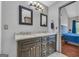 Modern bathroom featuring a dual sink vanity with granite countertop and decorative lighting at 684 Doe Lane Ln, Loganville, GA 30052