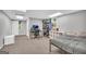 Spacious bedroom with gray walls featuring a bed and workstation at 684 Doe Lane Ln, Loganville, GA 30052