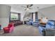 Expansive bonus room with carpet, various seating options, and ample space for activities at 684 Doe Lane Ln, Loganville, GA 30052