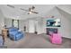Relaxing bonus room with carpet, comfortable chairs, a TV, and plenty of room at 684 Doe Lane Ln, Loganville, GA 30052