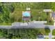 Aerial view featuring the pool, clubhouse, playground, and covered picnic tables at 684 Doe Lane Ln, Loganville, GA 30052