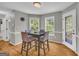 Charming eat in dining area with bay windows, hardwood floors and views of the backyard at 684 Doe Lane Ln, Loganville, GA 30052