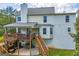 Overhead shot of the house with a deck, patio, and well maintained lawn at 684 Doe Lane Ln, Loganville, GA 30052