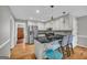 Kitchen with stainless steel appliances, gray cabinets, granite countertops and eat in bar at 684 Doe Lane Ln, Loganville, GA 30052
